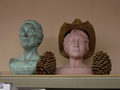 Plaster (green) and clay portraits